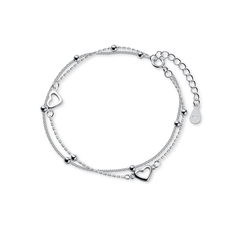 Pulsera doble cadena ajustable con pequeños corazones y esferas metálicas para mujer