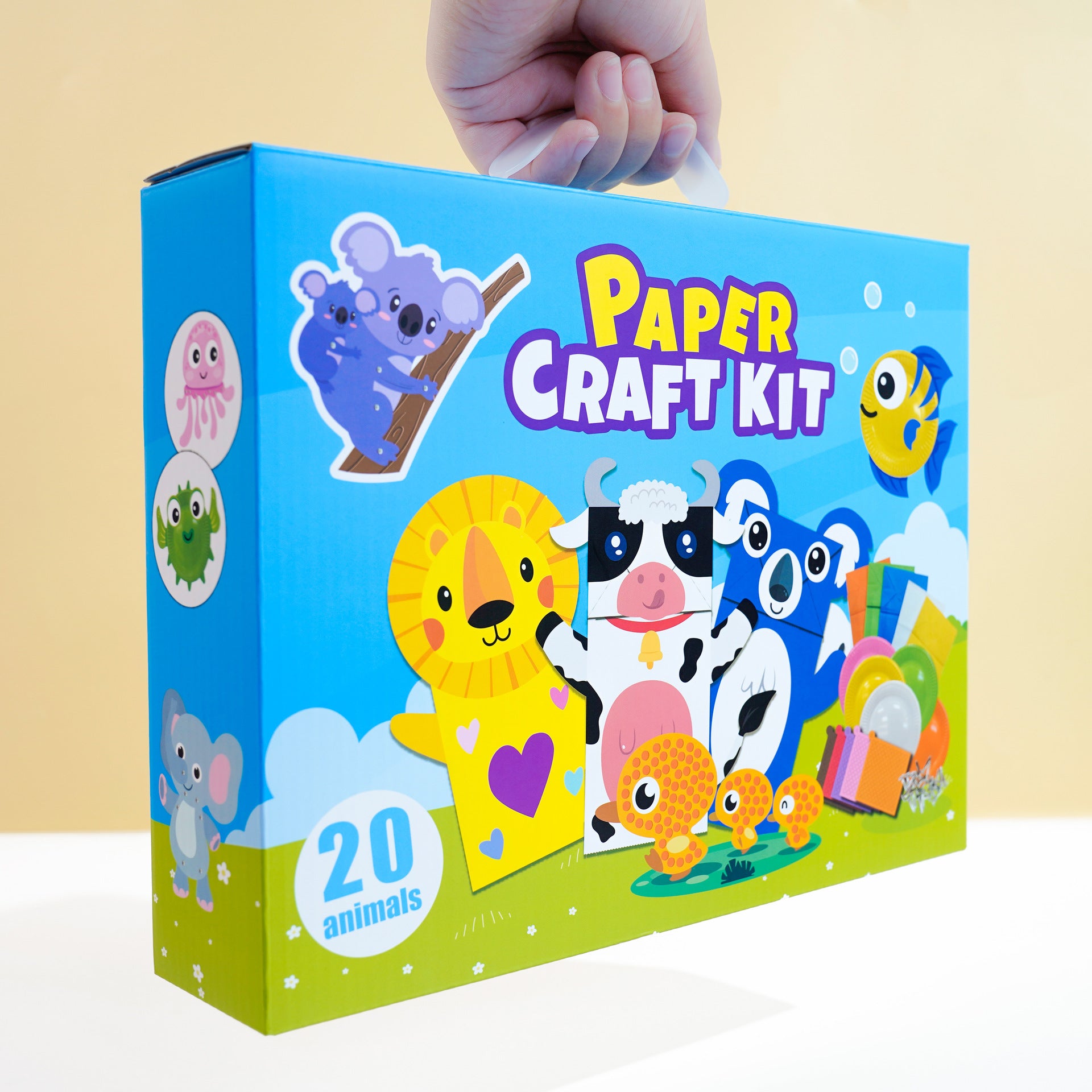 Caja del Kit de Manualidades para Niños: Animales de Papel, Disfraces y Más con diseño colorido y asa para transportar, ideal para regalar o usar en casa.