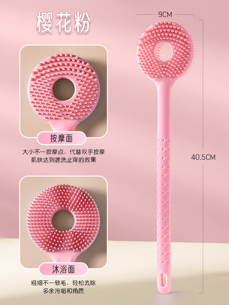 Cepillo de baño rosa 2 en 1 con cerdas suaves y doble función para masaje y limpieza, perfecto para una experiencia de baño revitalizante.