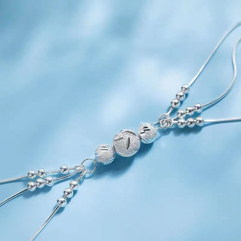 Pulsera Ajustable de Varios Hilos con Bolitas Metálicas – Estilo Elegante para Mujer