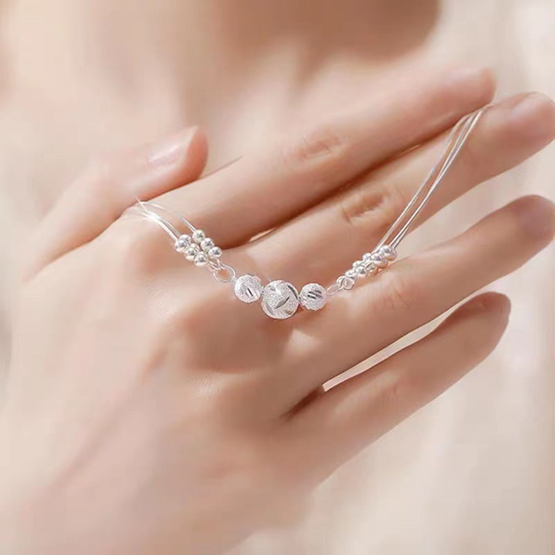 Pulsera Ajustable de Varios Hilos con Bolitas Metálicas – Estilo Elegante para Mujer