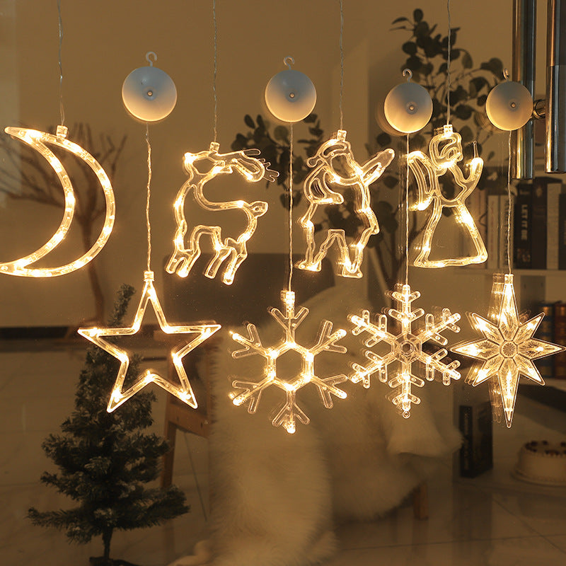 Decoración navideña con figuras de ciervo y estrellas