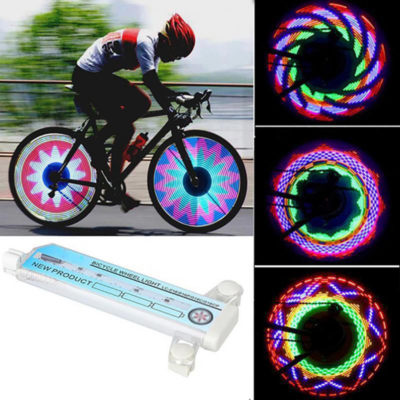 Luces LED para rueda de bicicleta en uso durante ciclismo urbano y nocturno, mostrando patrones brillantes multicolores en movimiento.