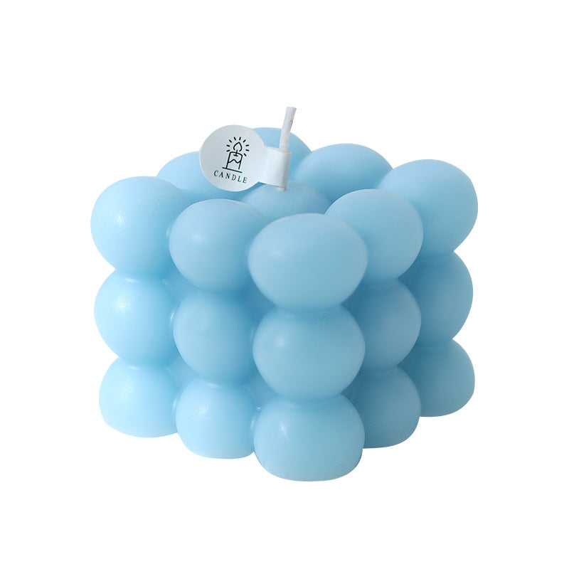 Vela aromática decorativa en forma de cubo con burbujas