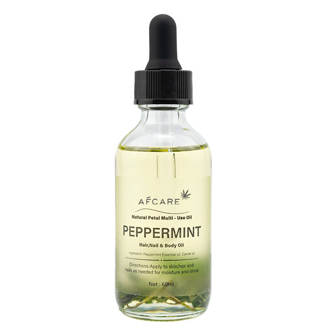 Aceite esencial de menta para cuerpo, cabello y uñas, con fórmula hidratante y aroma refrescante para uso diario en el cuidado corporal.