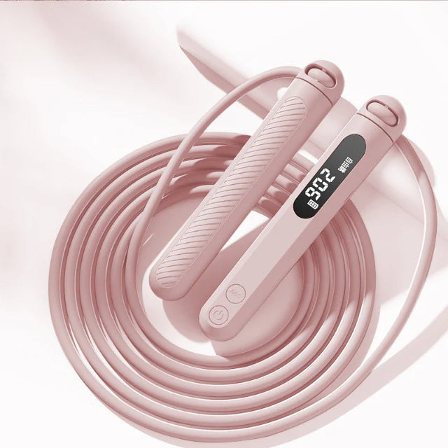 Comba digital inteligente rosa con pantalla LED y contador de saltos. Herramienta ajustable para entrenamiento fitness de alta precisión.