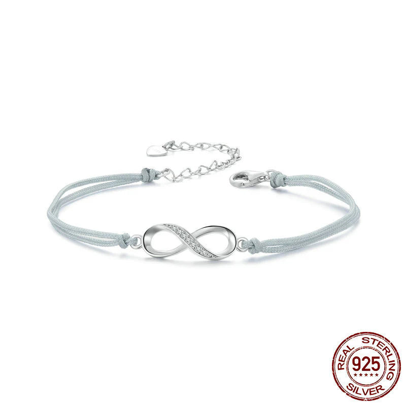 Pulsera de Hilo tejido con DIje de Infinito en plata 925 decorado con circonias